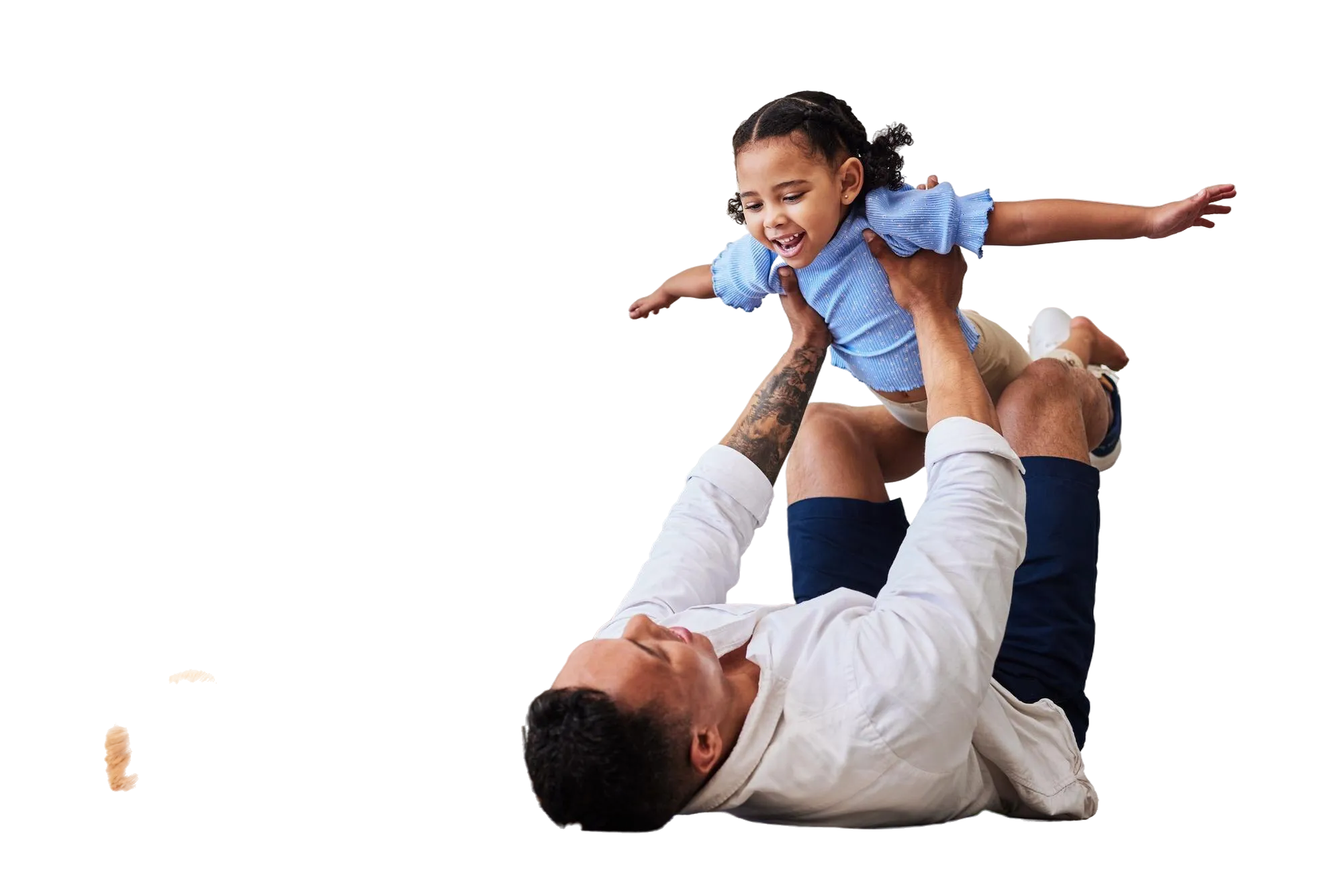 A father playing with his child on the living room floor