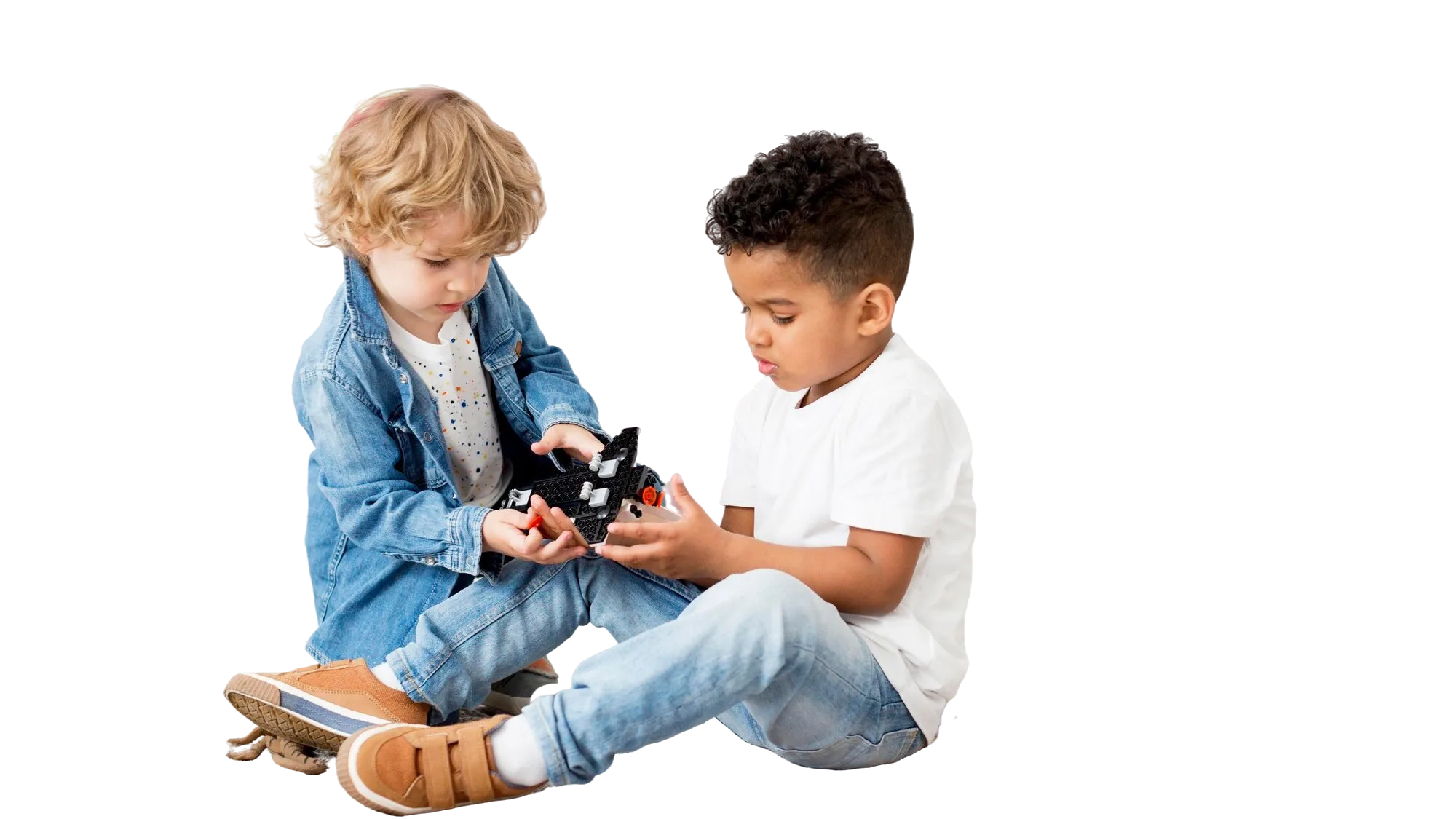 Young children playing inside a tent